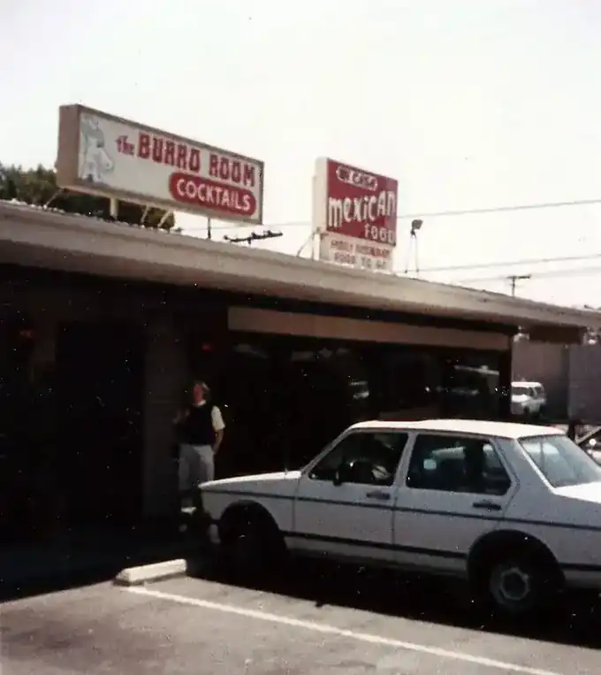 The Burro Room storefront with a 1980s car parked outside