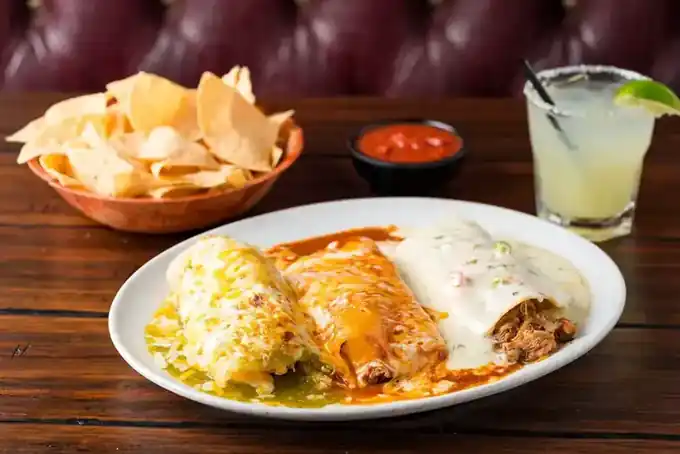 A burrito plate with rice and beans